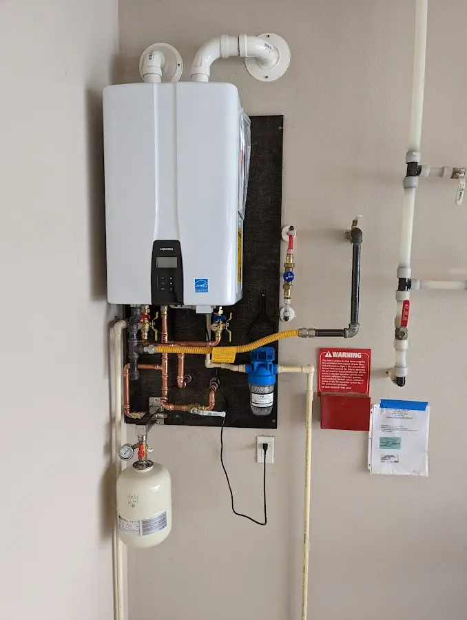 Professional plumber installing copper piping in a Lake Los Angeles home